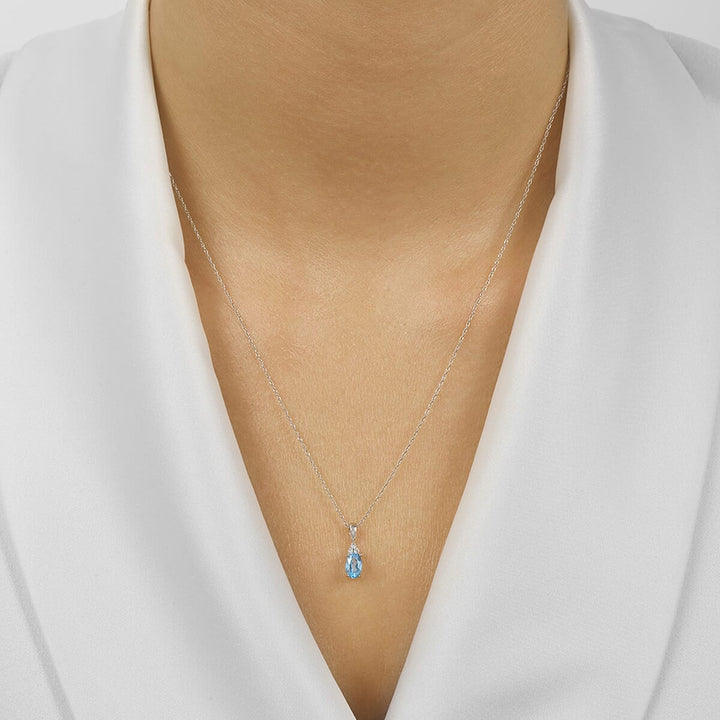 10Kt White Gold Diamond 1/50Ctw & Blue Topaz 3/8Ctw Pendant