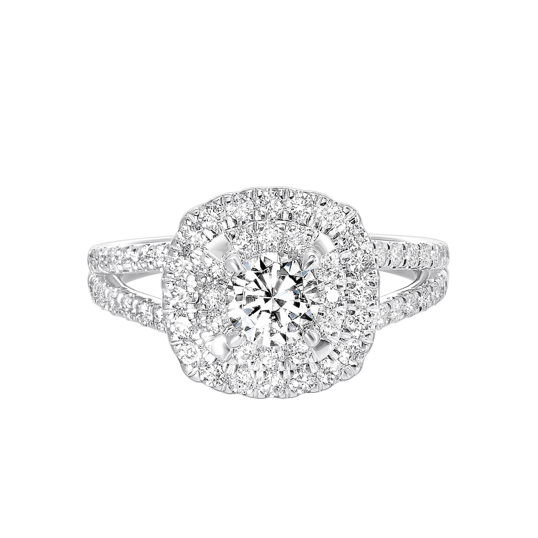 Elevated center surrounded by two sparkling cushion halos and split shank will mark your commitment to a lifelong promise