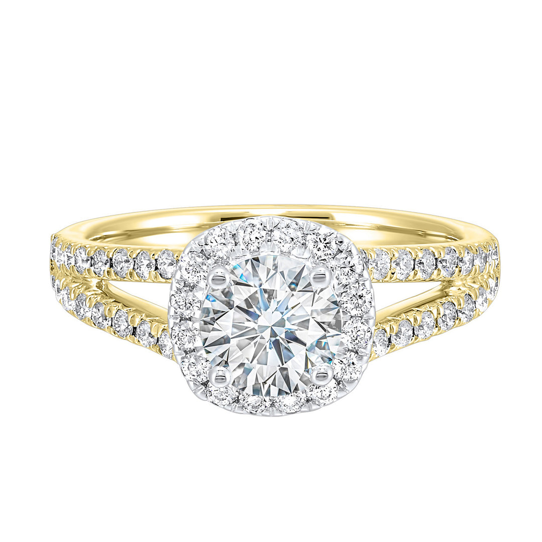 Cushion halo is a stunning way to showcase the round solitaire diamond. Modern split diamond studded shank further highlights the center.
