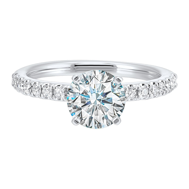 Classic and ready to make you shine, this ring features diamonds set in pave with a center solitaire.