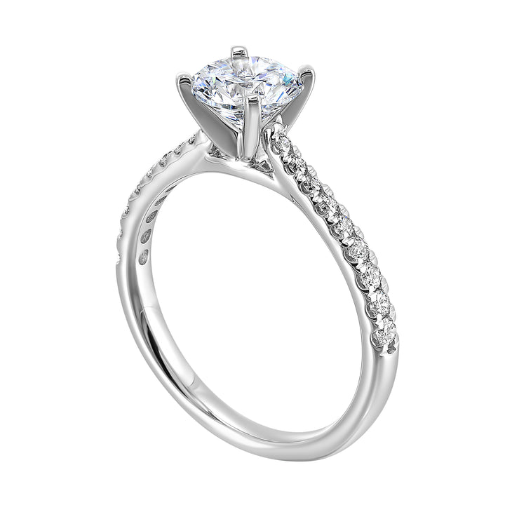 Petite set diamonds adds excitement to this classic solitaire ring perfectly showcases timeless love for her.