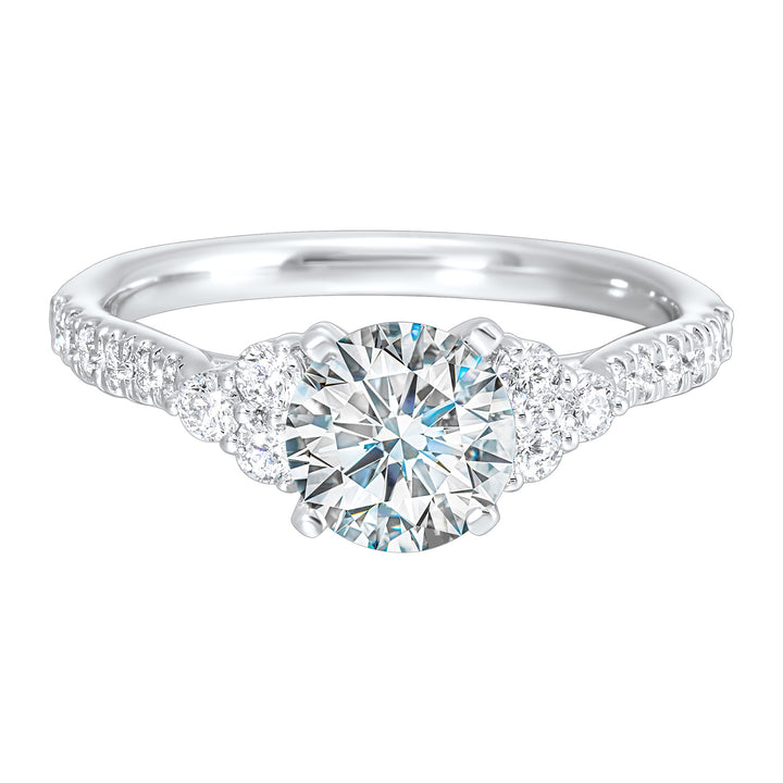 A trio of round diamonds on either side of the solitaire followed by a diamond studded shank, this ring is sure to impress her.