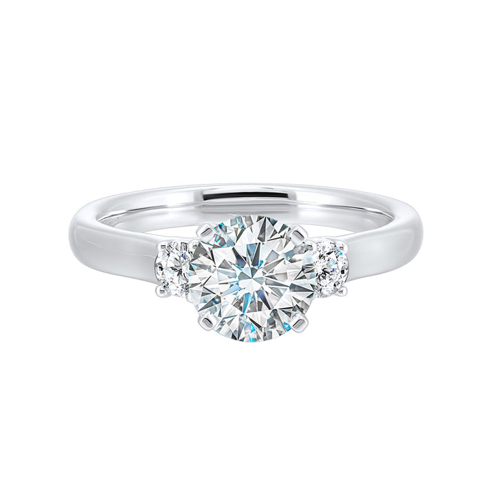 Classic and romantic, this three stone engagement ring features the bold gold shank to sparkle your moments further.
