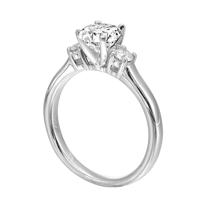 Classic and romantic, this three stone engagement ring features the bold gold shank to sparkle your moments further.