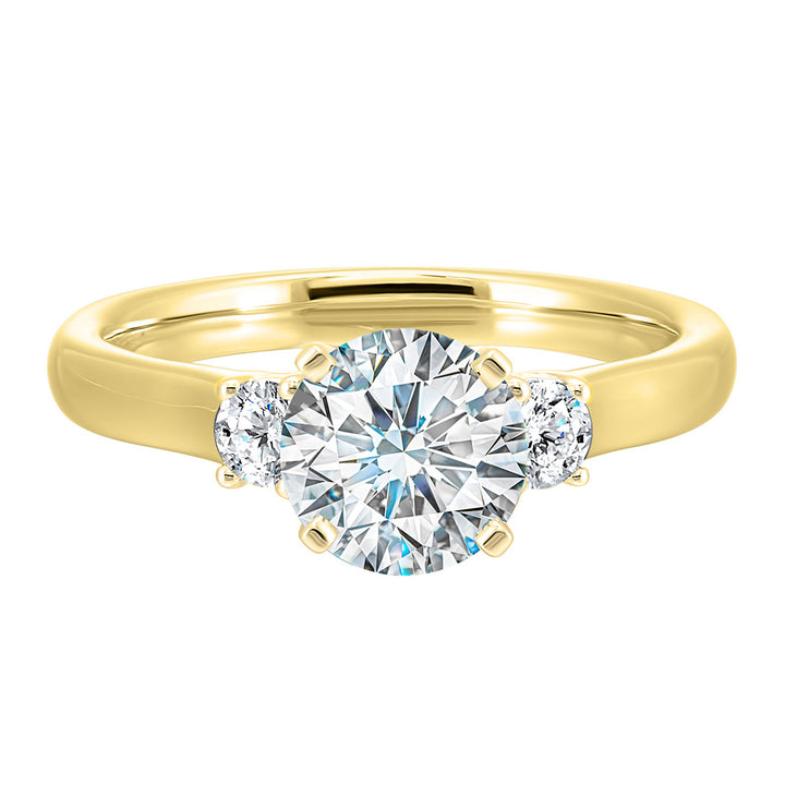 Classic and romantic, this three stone engagement ring features the bold gold shank to sparkle your moments further.