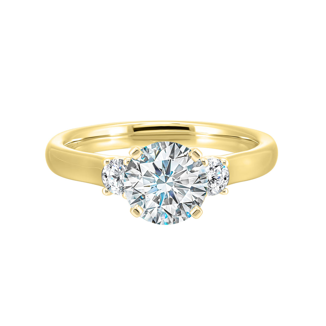 Classic and romantic, this three stone engagement ring features the bold gold shank to sparkle your moments further.