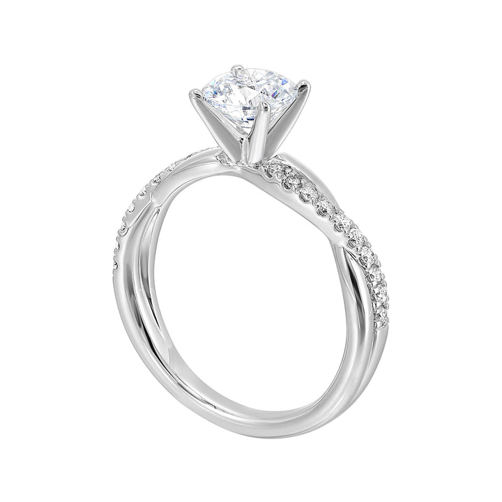 A stunning solitaire, embraced by a criss cross shank adorned with alternating flow of dazzling diamonds is sure to captivate her look.