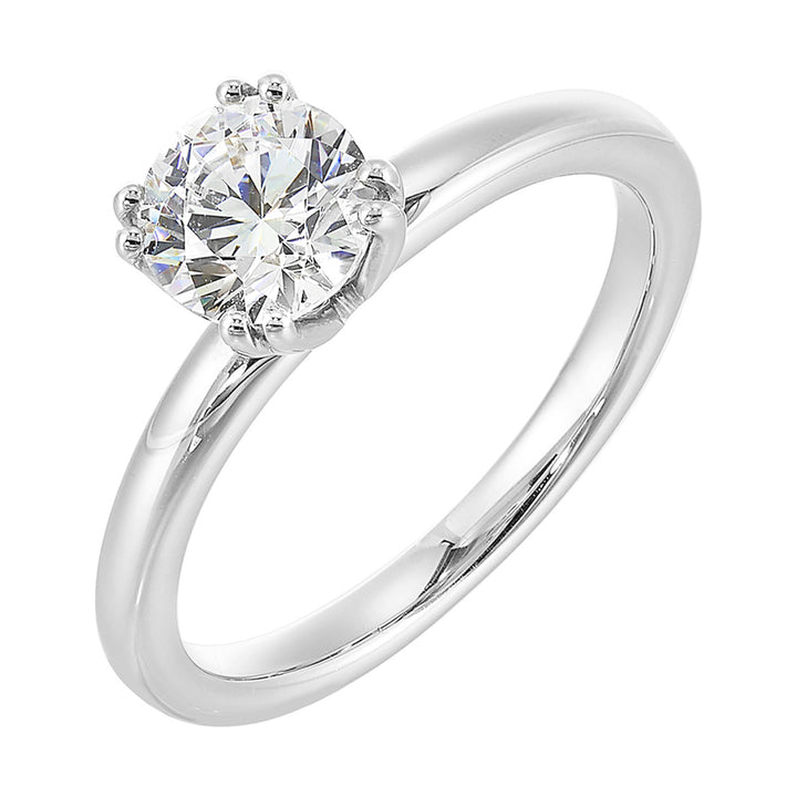 Chic and unique, this double prong setting solitare adds to the sleek, classic look to her style.