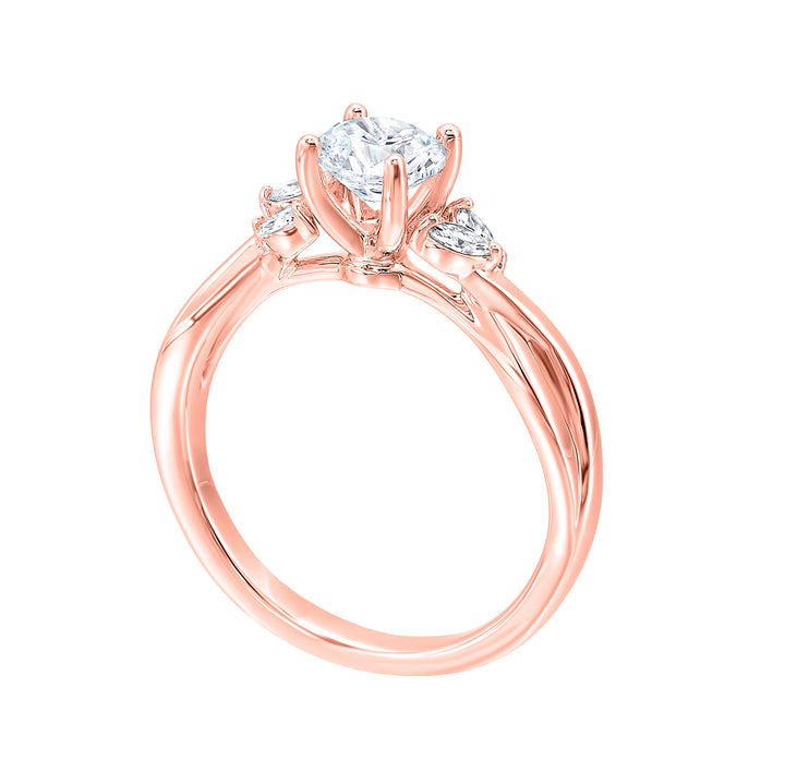 Gorgeous three stone twist engagement ring with added marquise on the shoulders highlights the center further.