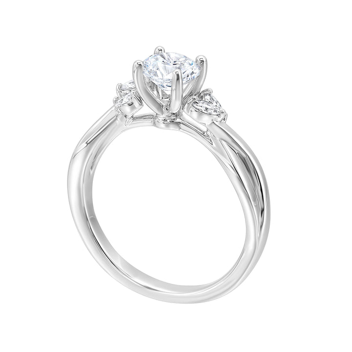 Gorgeous three stone twist engagement ring with added marquise on the shoulders highlights the center further.