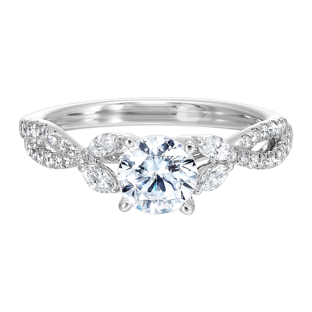 Embraced by a criss cross shank of pave diamonds. Two marquise diamond crown the band, adding a touch of unexpected elegance and a modern twist to this solitaire ring.
