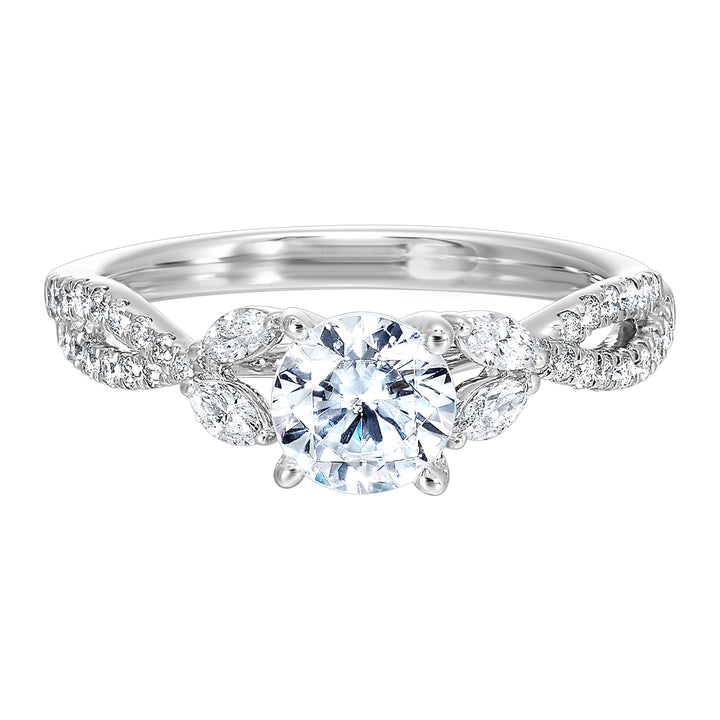 Embraced by a criss cross shank of pave diamonds. Two marquise diamond crown the band, adding a touch of unexpected elegance and a modern twist to this solitaire ring.
