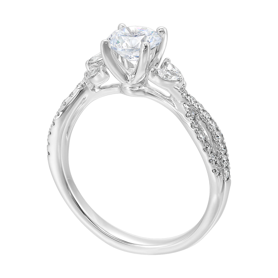 Embraced by a criss cross shank of pave diamonds. Two marquise diamond crown the band, adding a touch of unexpected elegance and a modern twist to this solitaire ring.