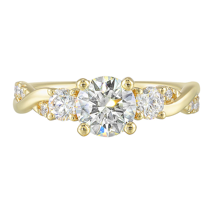 Gorgeous three stone ring features a round solitaire with one smaller diamond on either side. All of this sits a top a criss cross band with playful flow of diamond is a perfect choice.