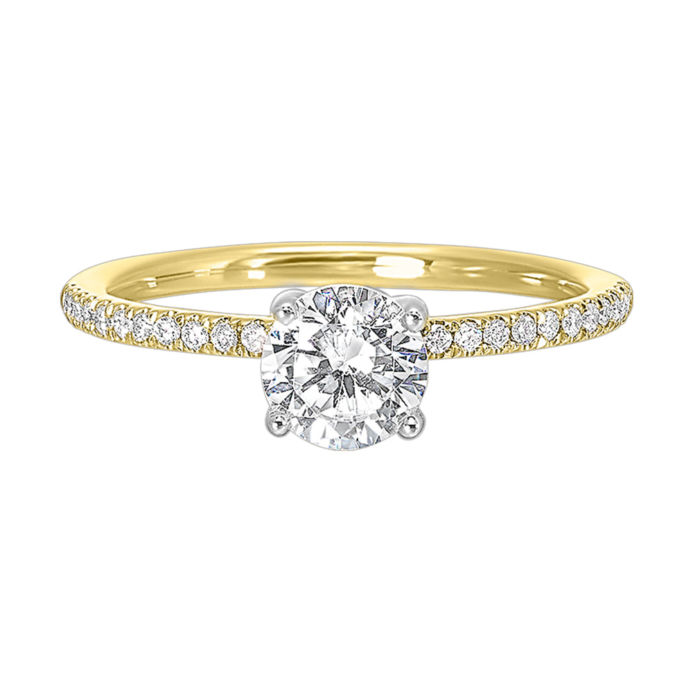 A solitaire ring features a delicate micro pave diamond shank, adding a touch of brilliance, is a timeless classic choice.