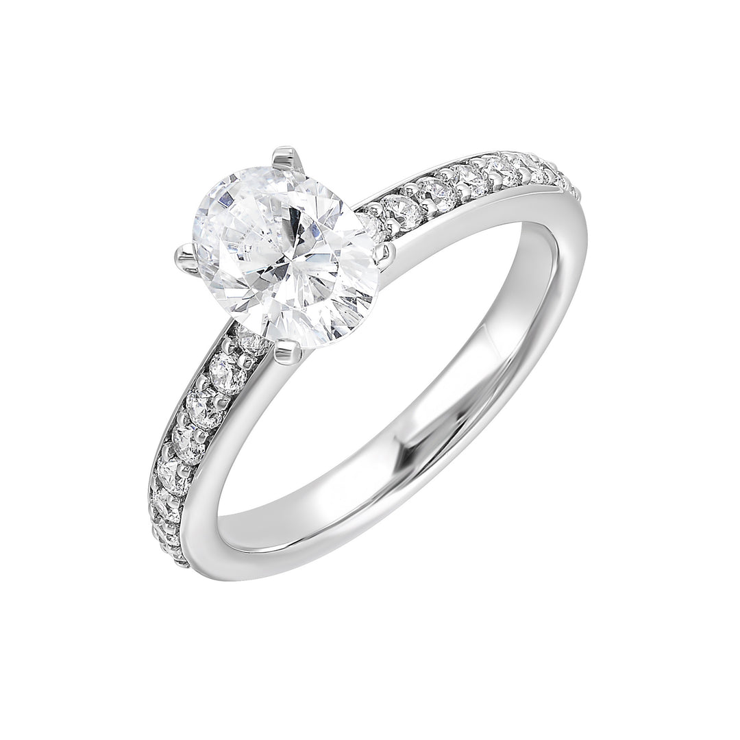 Sleek and beautiful, this diamond engagement ring set with pave diamonds complements the oval solitare.