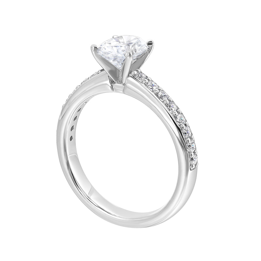 Sleek and beautiful, this diamond engagement ring set with pave diamonds complements the oval solitare.