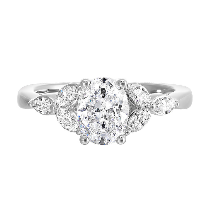 Elongated oval diamond takes center stage, framed by graceful trinity of marquise diamonds set on either side followed by a pinch shank is sure to flatten her.