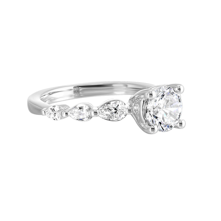 Round solitaire meets graduating pear cut diamonds set in common prongs blending classic elegance with contemporary style.