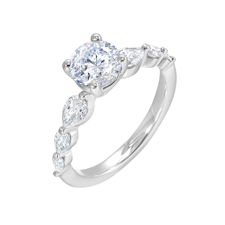 Round solitaire meets graduating pear cut diamonds set in common prongs blending classic elegance with contemporary style.