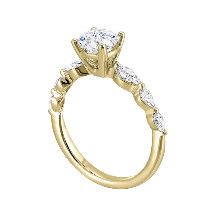 Round solitaire meets graduating pear cut diamonds set in common prongs blending classic elegance with contemporary style.