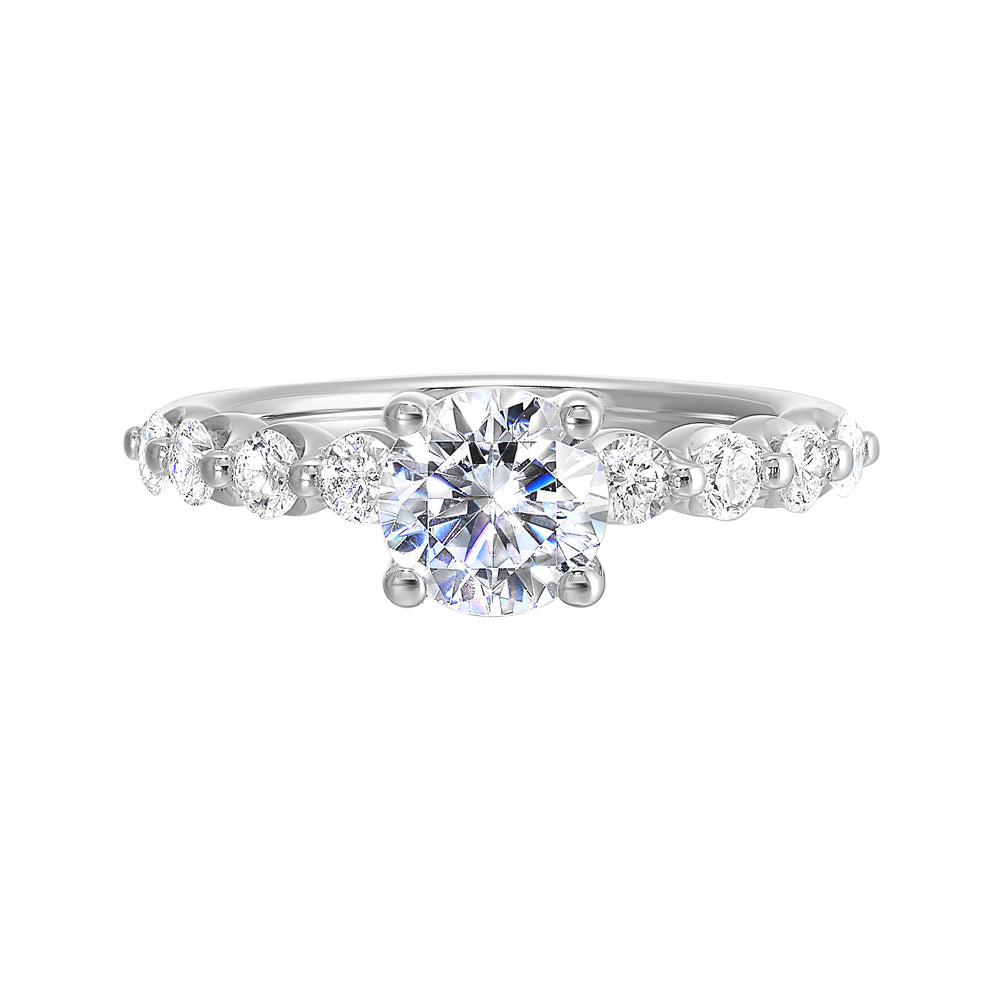 This lovely solitare ring is accented with bigger accent diamonds along the shank showcases the timeless love.