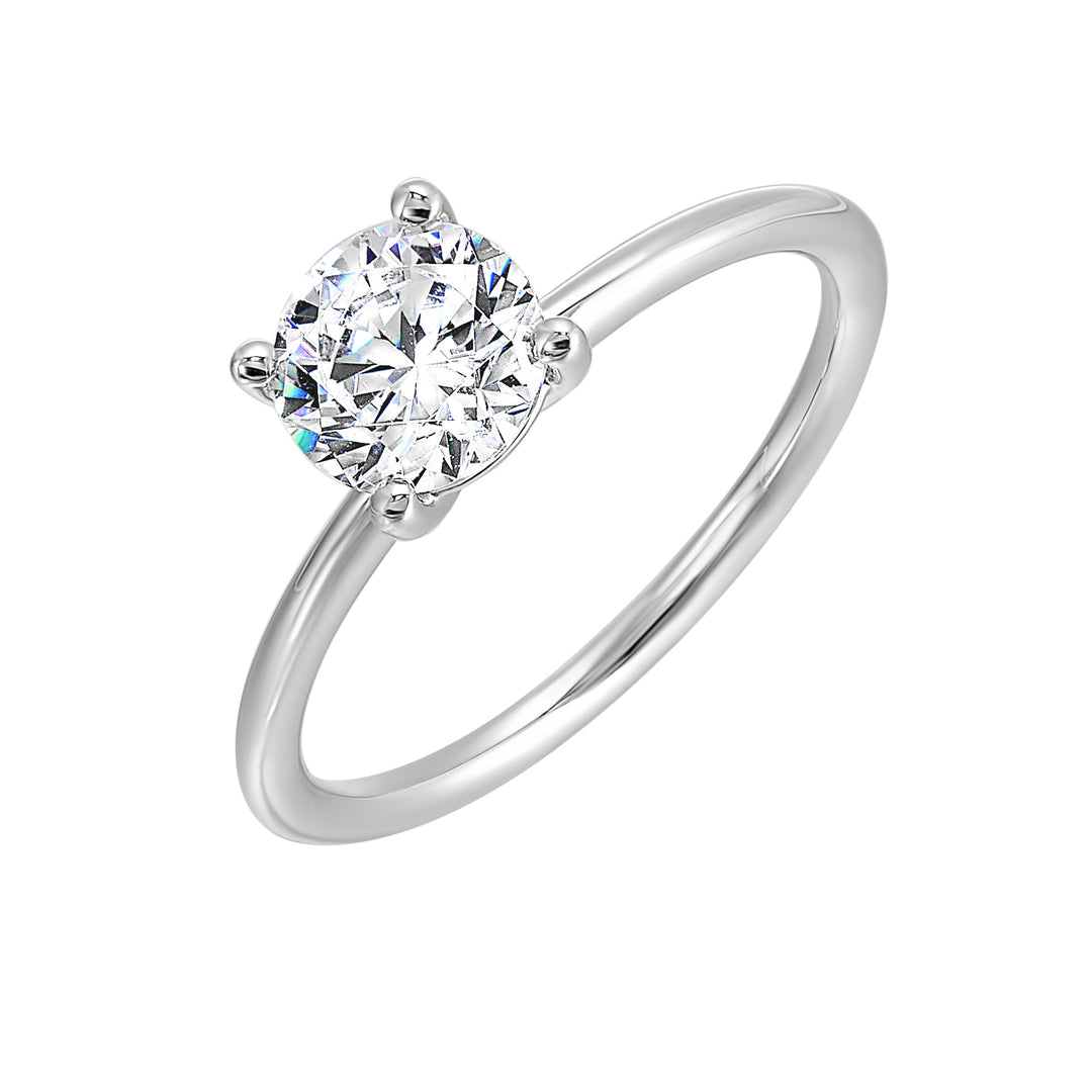 Classic four prong solitaire engagement ring with a petite band adds to the sleek, classic look of the design.