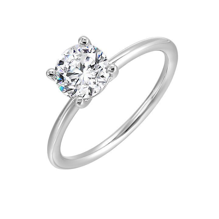 Classic four prong solitaire engagement ring with a petite band adds to the sleek, classic look of the design.
