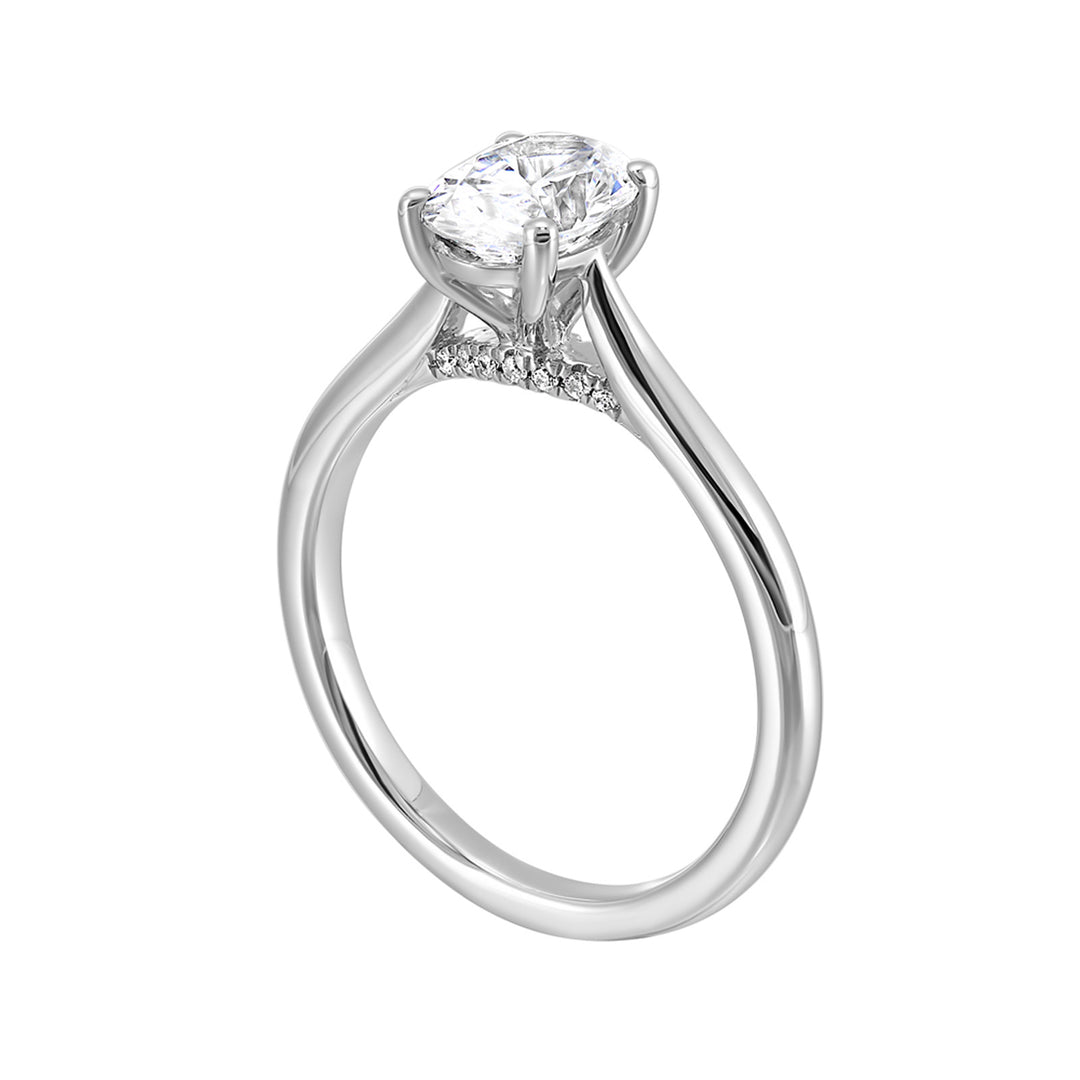 Effortless and classy this dazzling four prong oval solitaire ring features a clean, classic look with a sleek band.