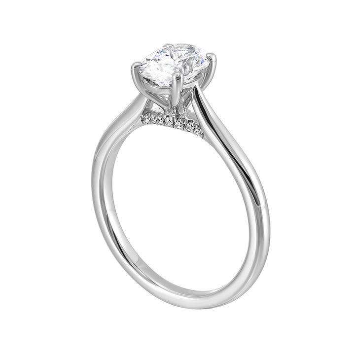 Effortless and classy this dazzling four prong oval solitaire ring features a clean, classic look with a sleek band.