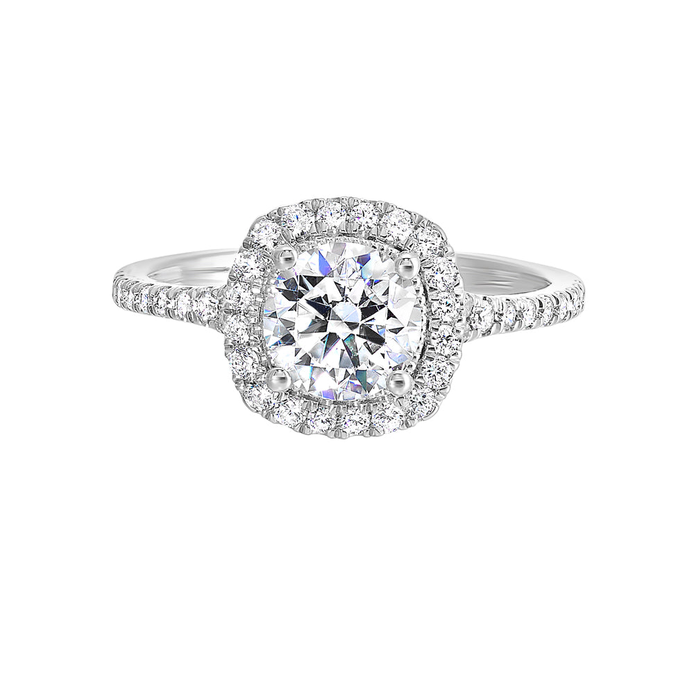 Sparkling cushion halo features beautiful set pav? diamonds that encircle the center solitare and adorn the band.