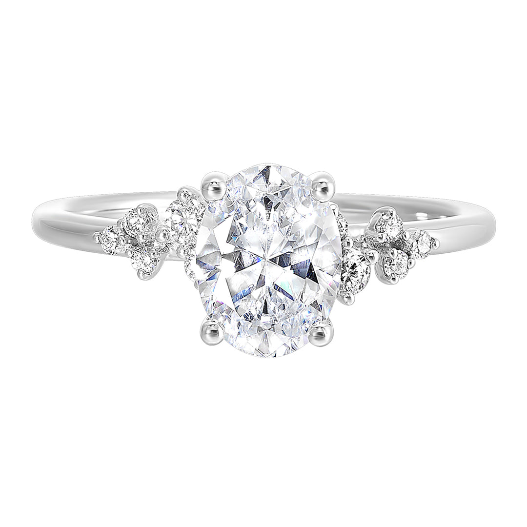 This simply gorgeous engagement ring with oval center features a sleek gold band with floating diamonds on either sides in random placement coming together beautifully.