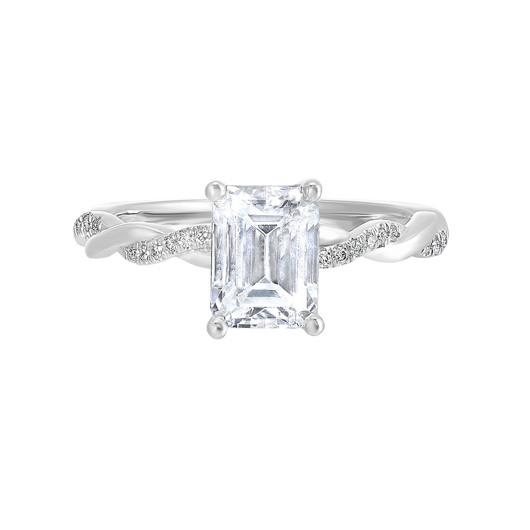 This beautiful ring features a shimmering strand of pave diamonds entwined with a lustrous metal highlights the emerald center.