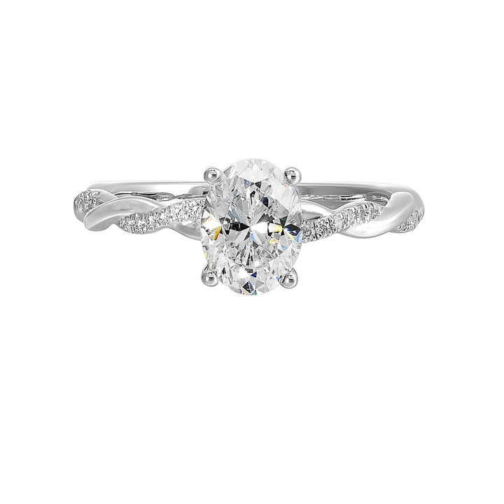 This ring is is sure to surprise her, featuring an oval center which is further enhanced by play of diamond and metal twist shank.