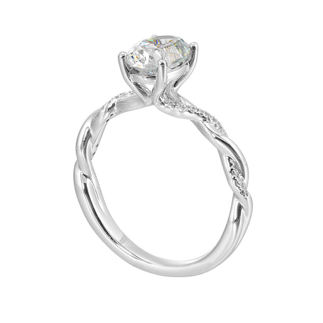 This ring is is sure to surprise her, featuring an oval center which is further enhanced by play of diamond and metal twist shank.