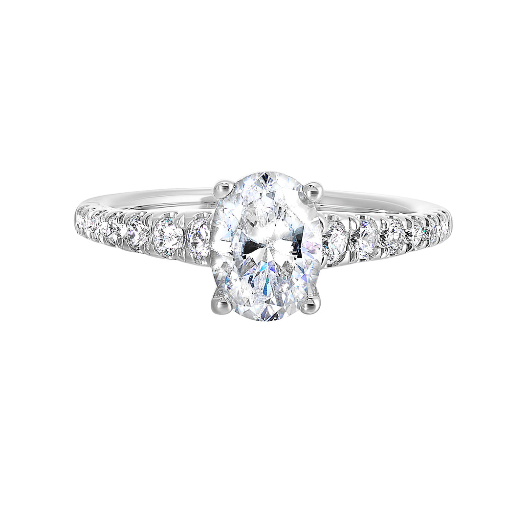 Defined by a tapered shank set with graduated round diamonds, this classic oval solitaire engagement ring gracefully compliments your look.