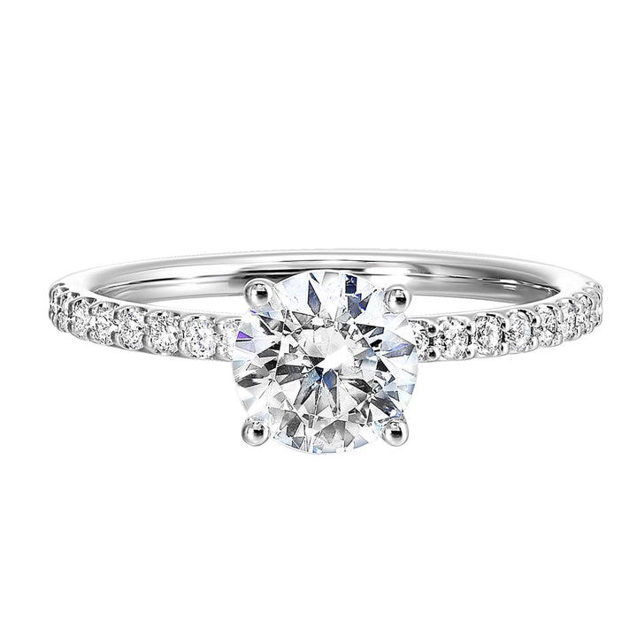 This solitaire ring boasts a dazzling micro pave on shank, offering sparkle to this delicate design offers timeless look.