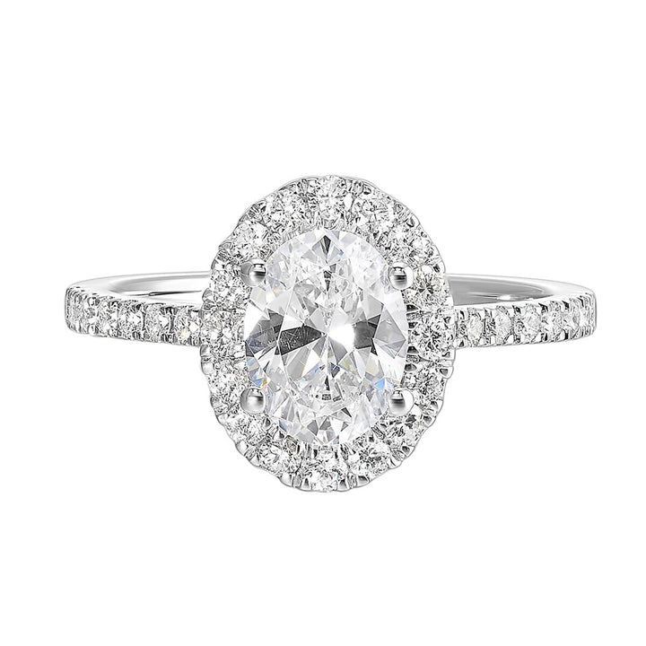 Oval solitaire halo ring with sleek diamond studded shank, this design offers a romantic look for your special moments.