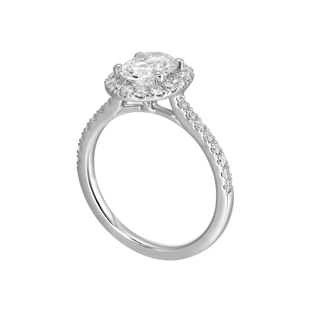 Oval solitaire halo ring with sleek diamond studded shank, this design offers a romantic look for your special moments.