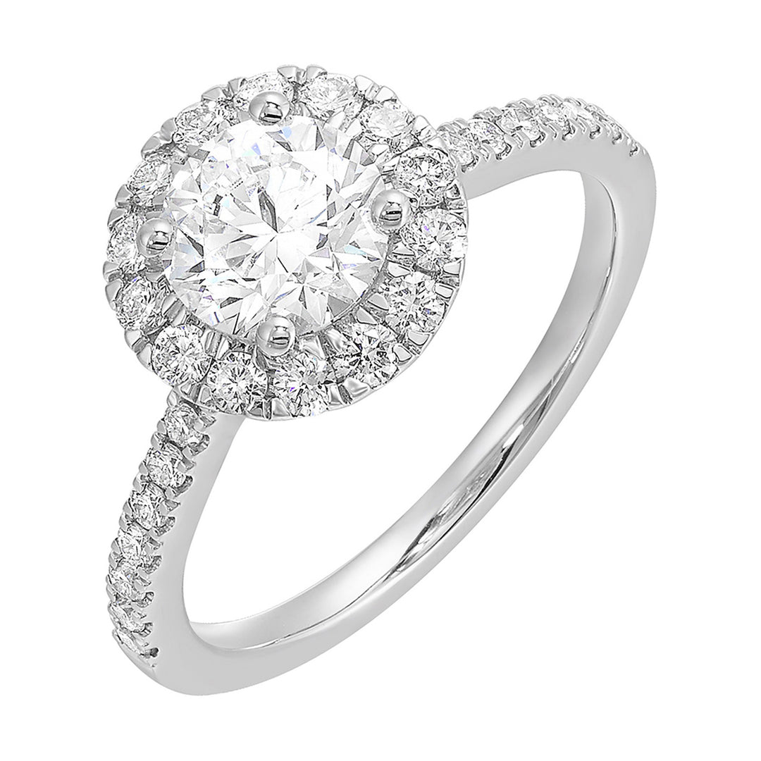 Dazzle with classic round solitaire framed by a sparkling halo. The studded shank adds a touch of classic look, making this ring a timeless symbol of elegance.