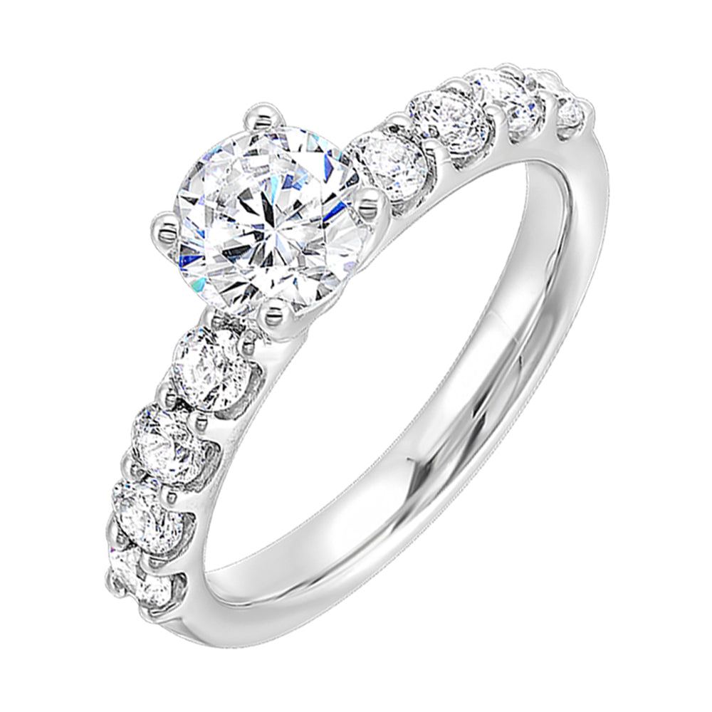 Bigger round diamonds rest on either side of this solitaire engagement ring, creating a modern yet timeless look.