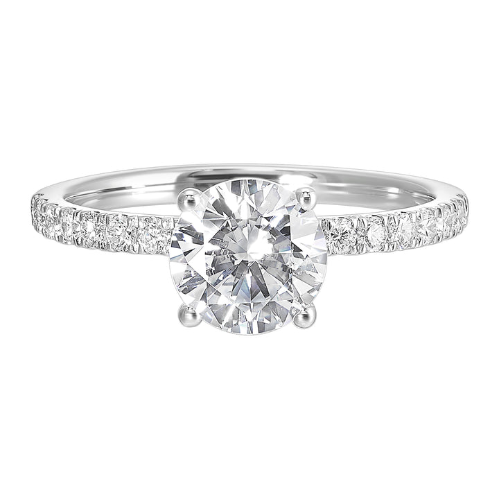 Shine from every angle with this gorgeous round solitaire hidden halo engagement ring. This timeless design offers elegance making it everlasting symbol of your love.
