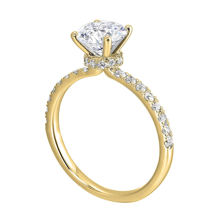 Shine from every angle with this gorgeous round solitaire hidden halo engagement ring. This timeless design offers elegance making it everlasting symbol of your love.