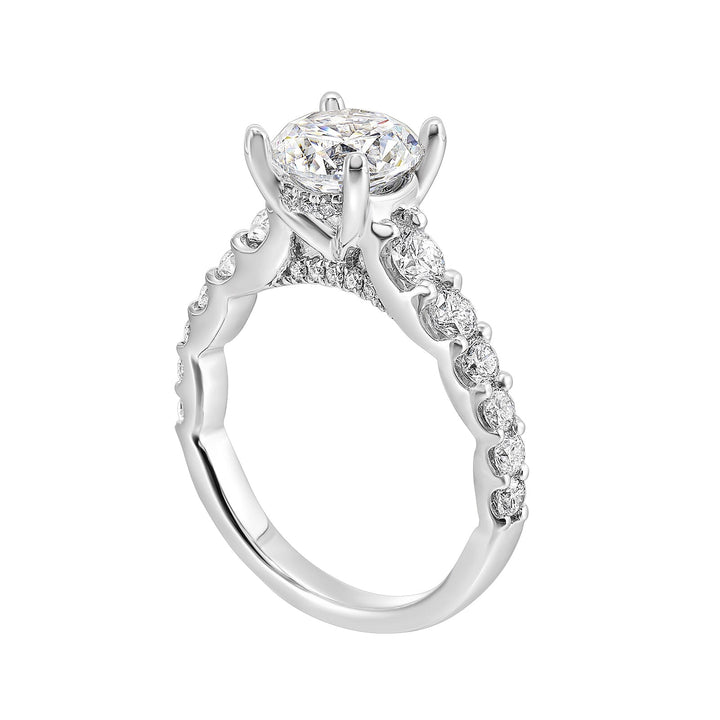 A classic round solitaire elevated by a graduating diamond shank set in common prong offers timeless elegance. Is perfect for your love story.