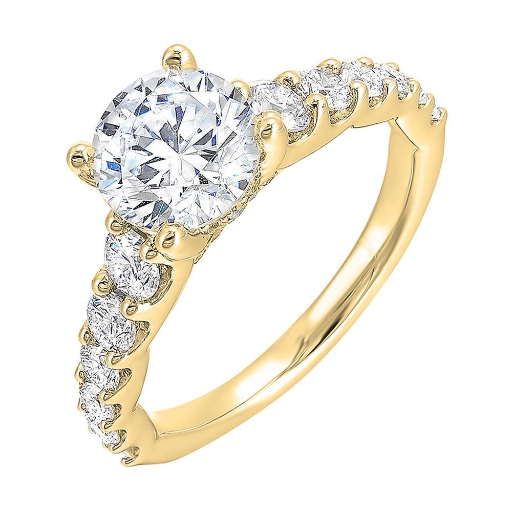A classic round solitaire elevated by a graduating diamond shank set in common prong offers timeless elegance. Is perfect for your love story.