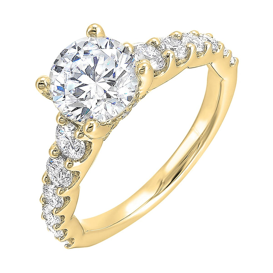 A classic round solitaire elevated by a graduating diamond shank set in common prong offers timeless elegance. Is perfect for your love story.