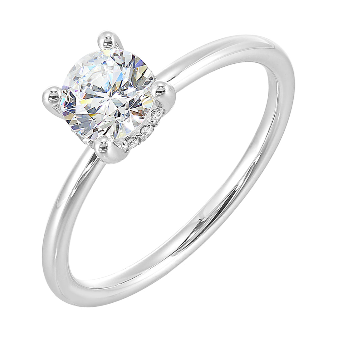 The dazzling solitare diamond take center stage. The petite band adds to the sleek,  classic look.