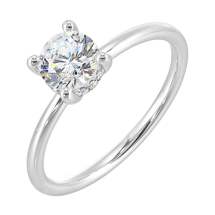 The dazzling solitare diamond take center stage. The petite band adds to the sleek,  classic look.