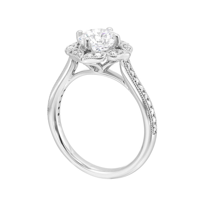 The solitaire ring gets a upgrade with a floral halo and diamond studded shank making your love blossom forever.