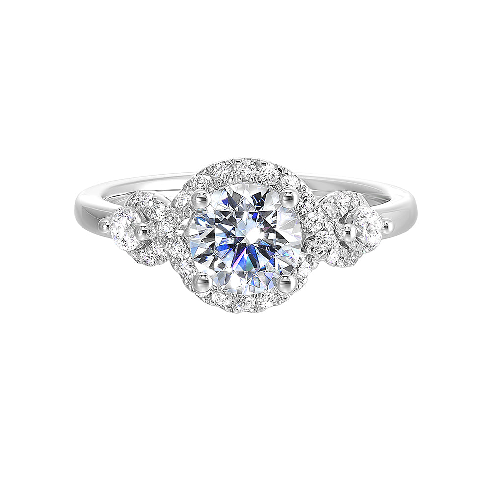 Encircling the base of solitare center with pave of glittering diamonds this three stone ring is sure to enchant her.